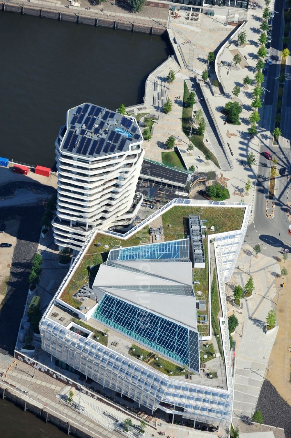 Hamburg from the bird's eye view: View of the Marco-Polo-Tower and the German headquarters of Unilever in Hamburg-HafenCity. The 2009 and 2010 completed buildings are the first of many projects at the Strandkai, a partial area of the HafenCity and were designed by the Stuttgart architects Behnisch Architekten