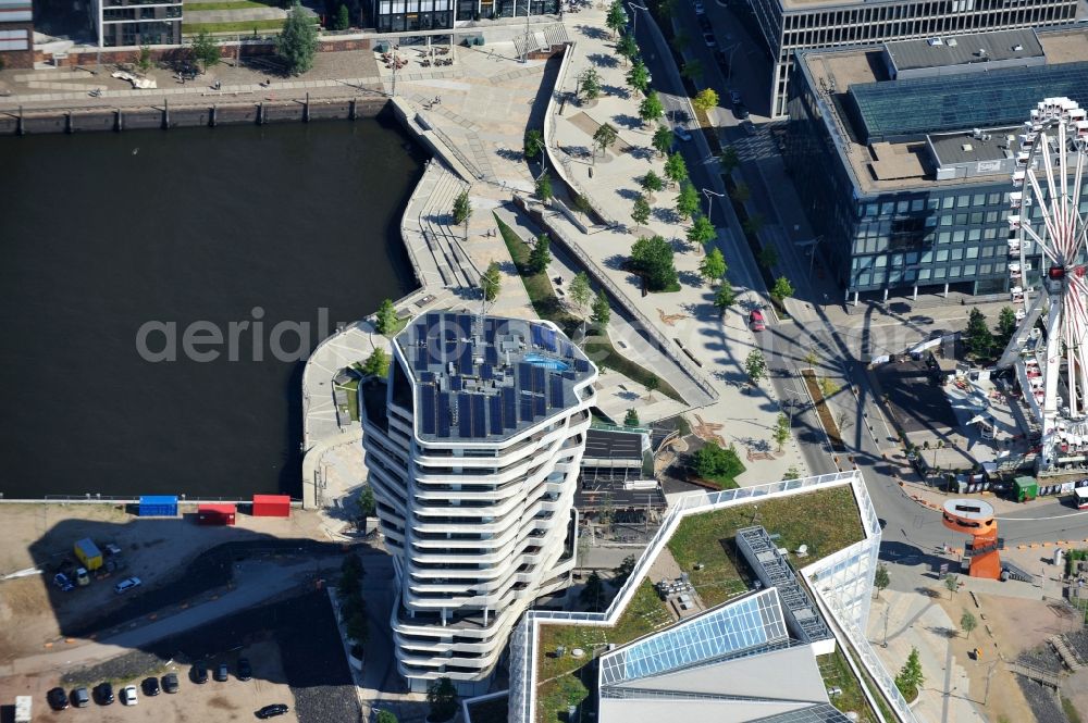 Aerial image Hamburg - View of the Marco-Polo-Tower and the German headquarters of Unilever in Hamburg-HafenCity. The 2009 and 2010 completed buildings are the first of many projects at the Strandkai, a partial area of the HafenCity and were designed by the Stuttgart architects Behnisch Architekten