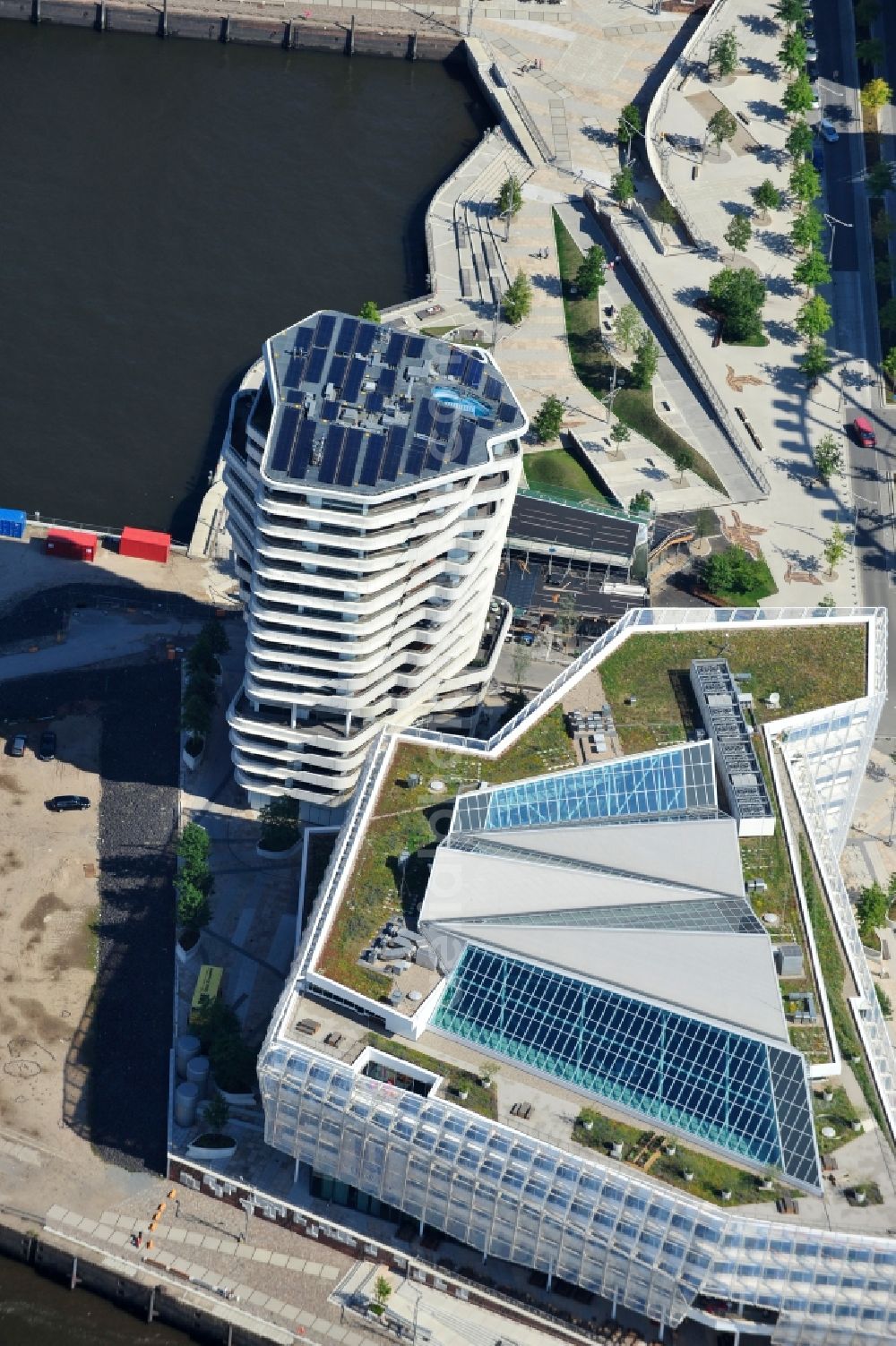 Hamburg from above - View of the Marco-Polo-Tower and the German headquarters of Unilever in Hamburg-HafenCity. The 2009 and 2010 completed buildings are the first of many projects at the Strandkai, a partial area of the HafenCity and were designed by the Stuttgart architects Behnisch Architekten