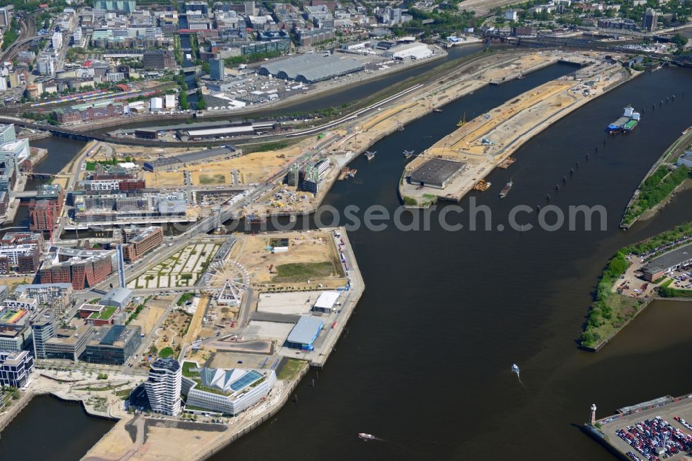 Aerial image Hamburg - View of the Marco-Polo-Tower and the German headquarters of Unilever in Hamburg-HafenCity. The 2009 and 2010 completed buildings are the first of many projects at the Strandkai, a partial area of the HafenCity and were designed by the Stuttgart architects Behnisch Architekten. In the background the urban development area Baakenhafen