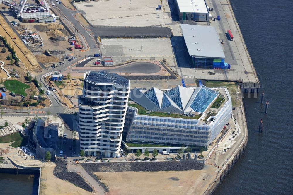 Aerial photograph Hamburg - View of the Marco-Polo-Tower and the German headquarters of Unilever in Hamburg-HafenCity. The 2009 and 2010 completed buildings are the first of many projects at the Strandkai, a partial area of the HafenCity and were designed by the Stuttgart architects Behnisch Architekten