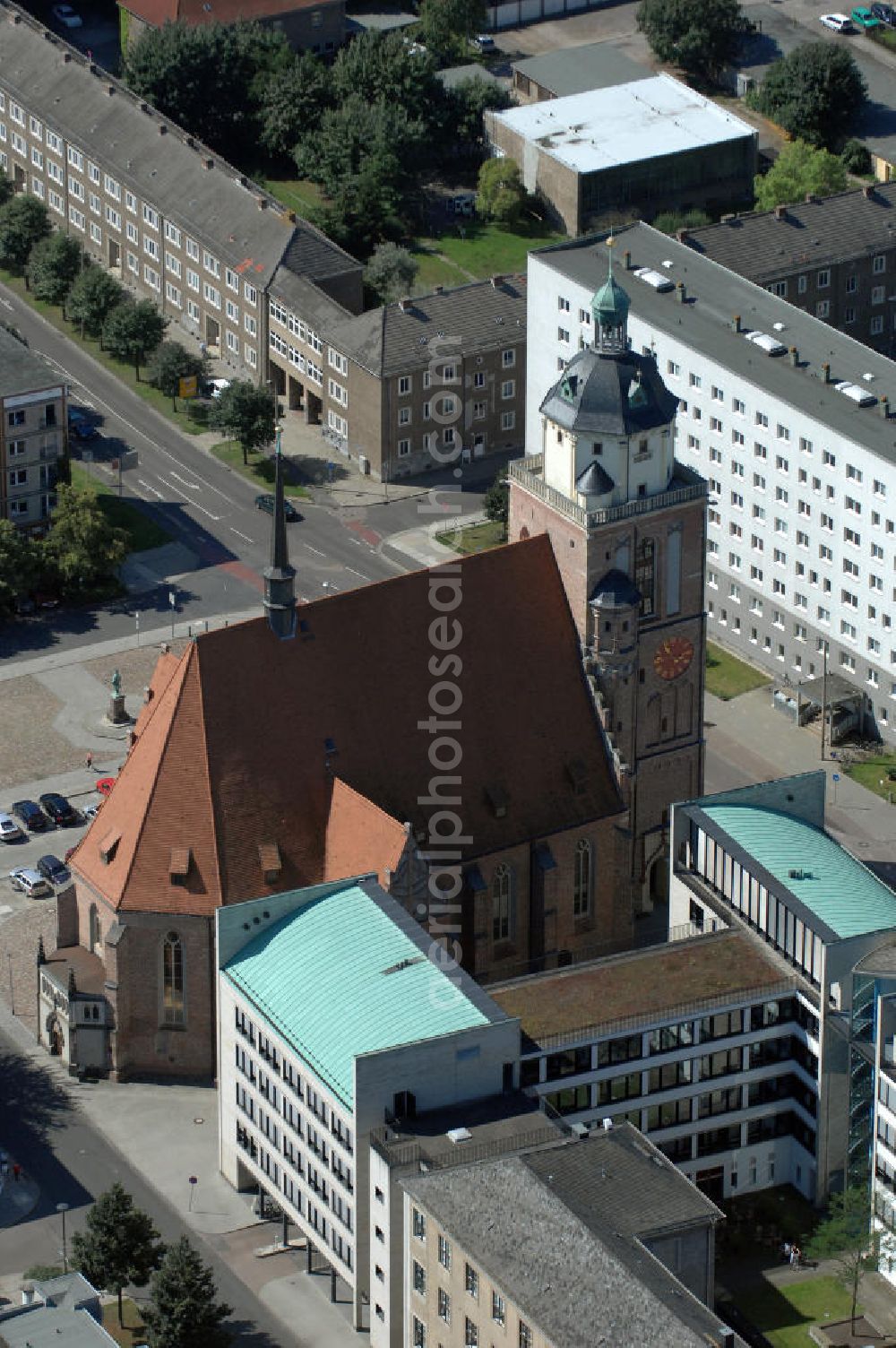 Aerial photograph Dessau-Roßlau - Blick auf die Marienkirche am Schloßplatz, auch Schloßkirche St. Marien. St. Marien wurde durch Bombenangriffe im Zweiten Weltkrieg am 7. März 1945 bis auf die Umfassungsmauern zerstört und brannte unter Vernichtung der Inneneinrichtung aus. Die Ruine wurde am 1. März 1983 dem Rat der Stadt Dessau übereignet und im Zeitraum von 1989 bis 1998 wieder aufgebaut, um seitdem als öffentlicher Veranstaltungsraum für Konzerte, Theateraufführungen, Sonderausstellungen und sonstige kulturelle Zwecke zu fungieren.