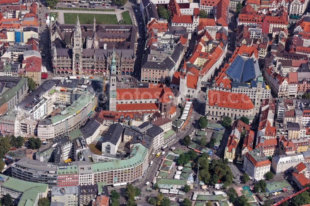 München from the bird's eye view: Ensemble around Marienplatz in the inner city center in Munich in the state Bavaria. In the picture the monument-protected ensemble: New Town Hall between Marienplatz and Marienhof in the pedestrian zone, old town hall, churches Saint Peter and Holy Spirit, Viktualienmarkt