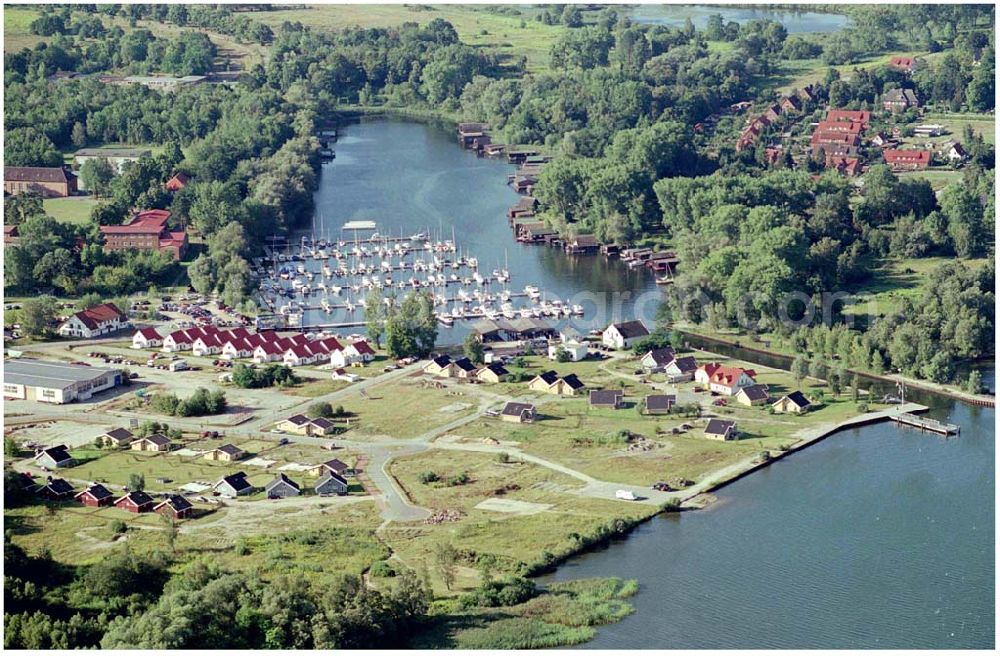 Aerial image Rechlin - 15.08.2004, Die Marina Claassee in Rechlin liegt in einem der schönsten Wassersport-Reviere Deutschlands, dabei ist sie nur an derthalb Autostunden von Berlin und gute zwei Stunden von Hamburg entfernt. Hier finden Segler alle wichtigen Dienstleistungen und Einkaufsangebote ­ in ebenso geschützter wie idyllischer Umgebung. Das Marinagelände befindet sich zwischen Claassee und Müritz-Nationalpark und gehört zum Ort Rechlin.