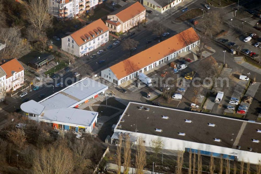 Berlin-Lichtenberg from the bird's eye view: Blick auf die Bauarbeiten vom market Einkaufszentrum in Berlin-Friedrichsfelde. Entstehen sollen über 5000 m² Mietfläche und 275 Pkw-Stellplätzen. Dieses moderne Einkaufszentrum mit einer Mischung aus Einzelhandel und Dienstleistung wird die neue Ortsmitte des Stadtteils bilden. Generalunternehmer ist die STRABAG Projektentwicklung GmbH Bereich Berlin, Bessemerstraße 42b, 12103 - Berlin - Tel.: (0)30 300680 - 0 - Fax: (0)30 300680 - 60