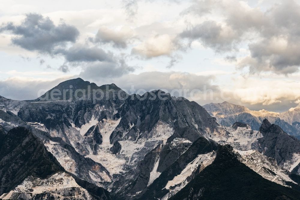 Aerial image Carrara - Marble quarry on the suburbs in Tuscany in Italy