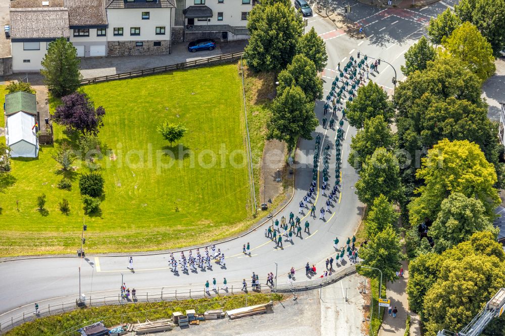 Arnsberg from above - Participating in the marching formationof St. Sebastianus Schuetzenbruderschaft 1766 e.V. on street L735 in Arnsberg at Sauerland in the state North Rhine-Westphalia, Germany