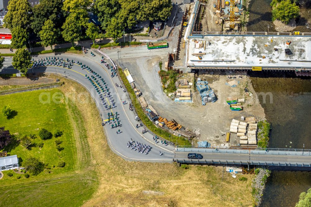 Arnsberg from above - Participating in the marching formationof St. Sebastianus Schuetzenbruderschaft 1766 e.V. on street L735 in Arnsberg at Sauerland in the state North Rhine-Westphalia, Germany