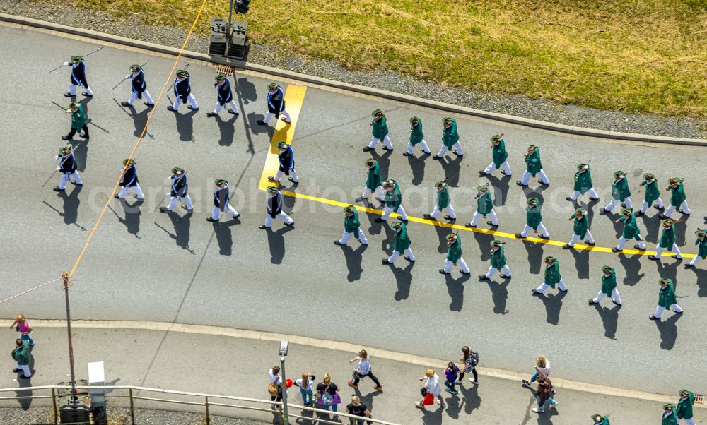 Aerial photograph Arnsberg - Participating in the marching formationof St. Sebastianus Schuetzenbruderschaft 1766 e.V. on street L735 in Arnsberg at Sauerland in the state North Rhine-Westphalia, Germany