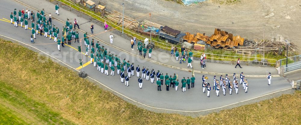 Arnsberg from above - Participating in the marching formationof St. Sebastianus Schuetzenbruderschaft 1766 e.V. on street L735 in Arnsberg at Sauerland in the state North Rhine-Westphalia, Germany