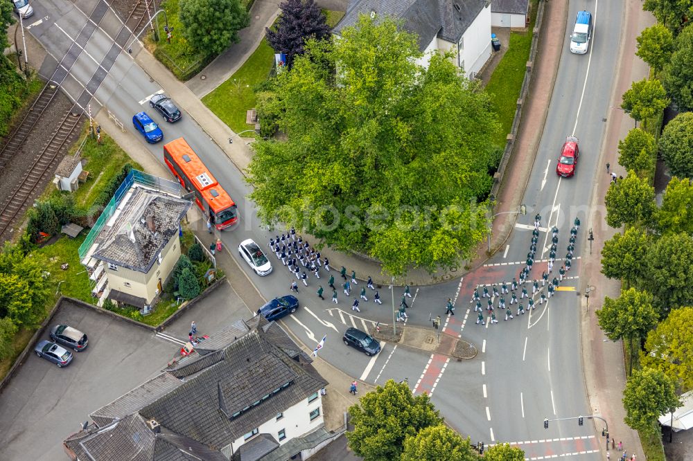 Aerial image Arnsberg - Participating in the marching formationof St. Sebastianus Schuetzenbruderschaft 1766 e.V. on street L735 in Arnsberg at Sauerland in the state North Rhine-Westphalia, Germany