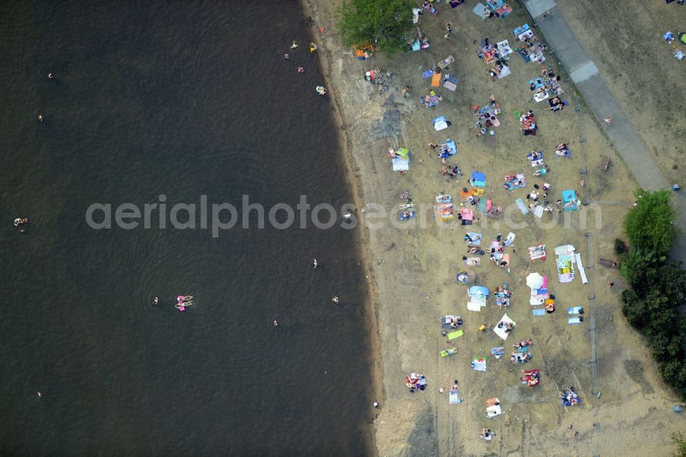 Berlin from above - Mass influx of bathers on the beach and the shore areas of the lake Mueggelsee in Berlin in Germany