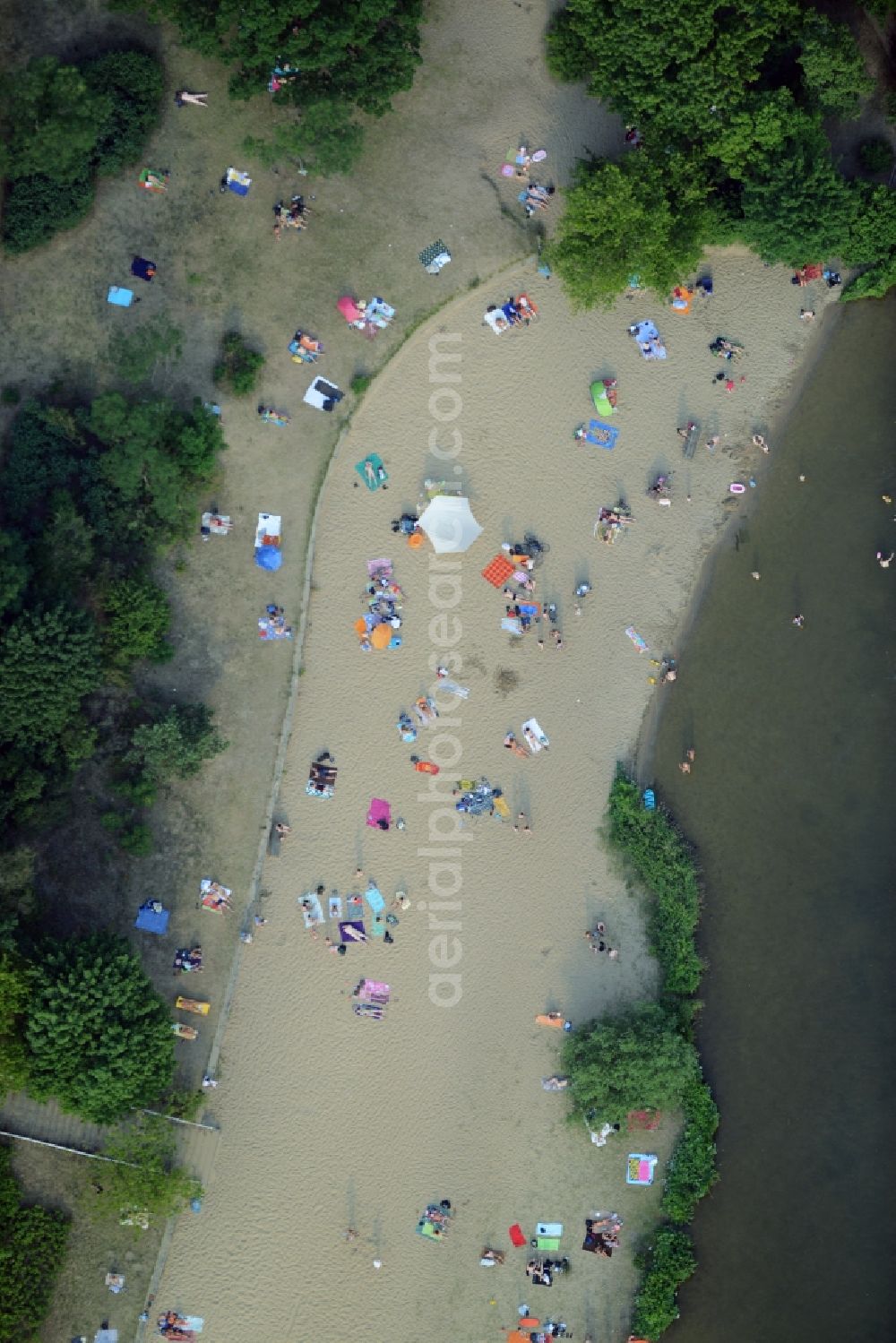 Berlin from above - Mass influx of bathers on the beach and the shore areas of the lake Mueggelsee in Berlin in Germany