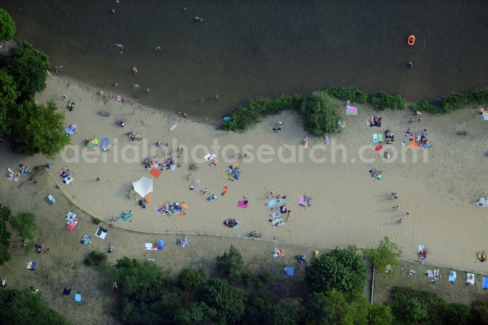 Berlin from above - Mass influx of bathers on the beach and the shore areas of the lake Mueggelsee in Berlin in Germany