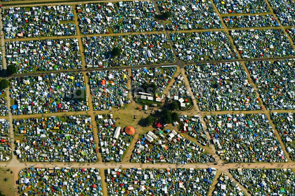 Lärz from the bird's eye view: Crowd of visitors to the Fusion Festival at the airfield Laerz - Rechlin in Laerz in Mecklenburg-Vorpommern, Germany