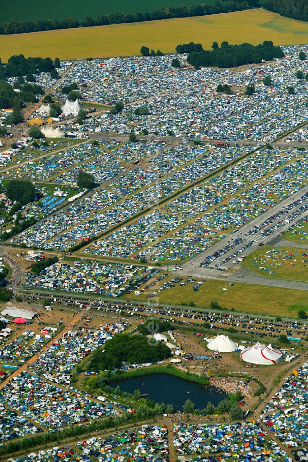 Lärz from the bird's eye view: Crowd of visitors to the Fusion Festival at the airfield Laerz - Rechlin in Laerz in Mecklenburg-Vorpommern, Germany