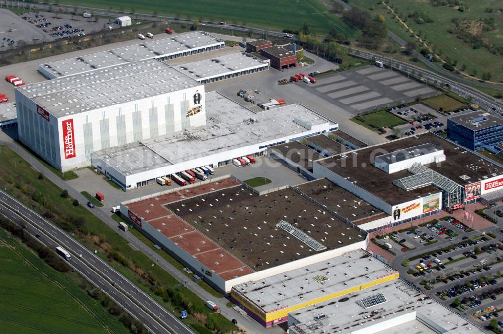 Berlin from the bird's eye view: Blick auf das Möbel-Höffner Einrichtungshaus im Gewerbegebiet Airport Center Waltersdorf in Berlin-Waltersdorf. View of the furniture store Möbel-Höffner in the business park Airport Center Waltersdorf in Berlin-Waltersdorf.