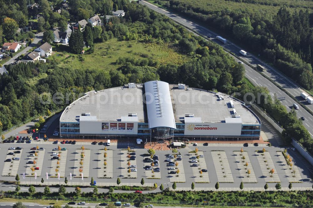 Lüdenscheid from the bird's eye view: Das Möbelhaus Sonneborn an der Autobahn-Ausfahrt Lüdenscheid Süd im Stadtteil Hellersen. Das Einrichtungshaus wurde 2000 eröffnet und eine Betriebsfläche von 28.000 Quadratmetern. The furniture store Sonneborn at the freeway exit Lüdenscheid Sud in the district Hellersen.