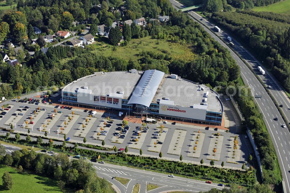 Aerial image Lüdenscheid - Das Möbelhaus Sonneborn an der Autobahn-Ausfahrt Lüdenscheid Süd im Stadtteil Hellersen. Das Einrichtungshaus wurde 2000 eröffnet und eine Betriebsfläche von 28.000 Quadratmetern. The furniture store Sonneborn at the freeway exit Lüdenscheid Sud in the district Hellersen.