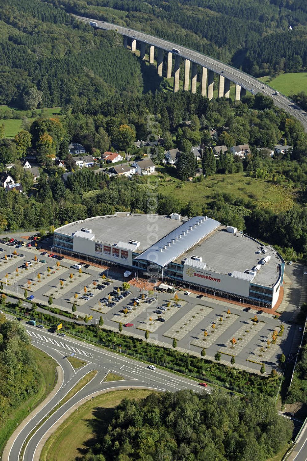 Lüdenscheid from above - Das Möbelhaus Sonneborn an der Autobahn-Ausfahrt Lüdenscheid Süd im Stadtteil Hellersen. Das Einrichtungshaus wurde 2000 eröffnet und eine Betriebsfläche von 28.000 Quadratmetern. The furniture store Sonneborn at the freeway exit Lüdenscheid Sud in the district Hellersen.