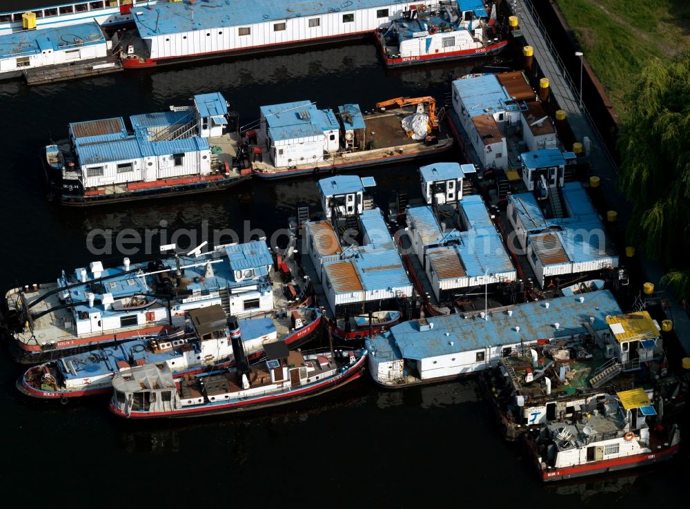 Berlin from the bird's eye view: MBS dock and thrust units of cargo ships - barges on the shore of Lake Rummelsburg in Berlin Treptow