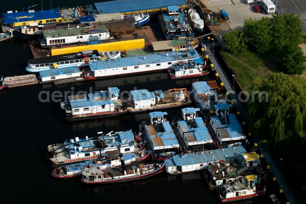 Berlin from the bird's eye view: MBS dock and thrust units of cargo ships - barges on the shore of Lake Rummelsburg in Berlin Treptow