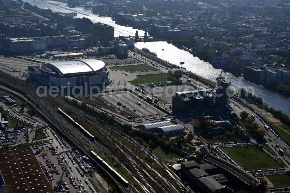 Aerial image Berlin - View at the Media Spree area at the Spree near Ostbahnhof between Oberbaum Bridge and Schilling Bridge in the district of Kreuzberg-Friedrichshain in Berlin. Media Spree is one of the biggest investors projects in Berlin. It aims the establishment of communications and media companies along an area approximately 3.7 km long and is appropriate to restructure. The picture shows among others the O2 Arena, the East Side Gallery, the former Post Station and the Oberbaum Bridge