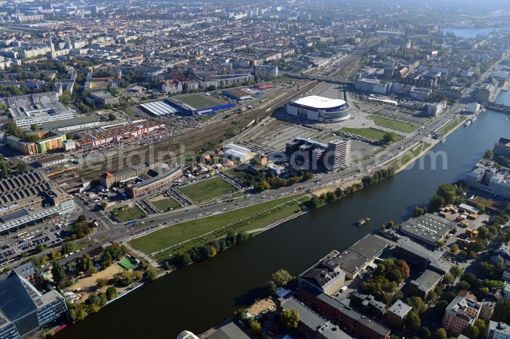 Berlin from above - View at the Media Spree area at the Spree near Ostbahnhof between Oberbaum Bridge and Schilling Bridge in the district of Kreuzberg-Friedrichshain in Berlin. Media Spree is one of the biggest investors projects in Berlin. It aims the establishment of communications and media companies along an area approximately 3.7 km long and is appropriate to restructure. The picture shows among others the O2 Arena, the East Side Gallery, the former Post Station and the Oberbaum Bridge