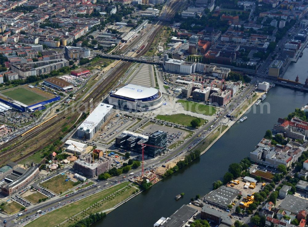 Berlin from above - View at the Media Spree area at the Spree near Ostbahnhof between Oberbaum Bridge and Schilling Bridge in the district of Kreuzberg-Friedrichshain in Berlin. Media Spree is one of the biggest investors projects in Berlin. It aims the establishment of communications and media companies along an area approximately 3.7 km long and is appropriate to restructure. The picture shows among others the O2 Arena, the East Side Gallery, the former Post Station and the Oberbaum Bridge