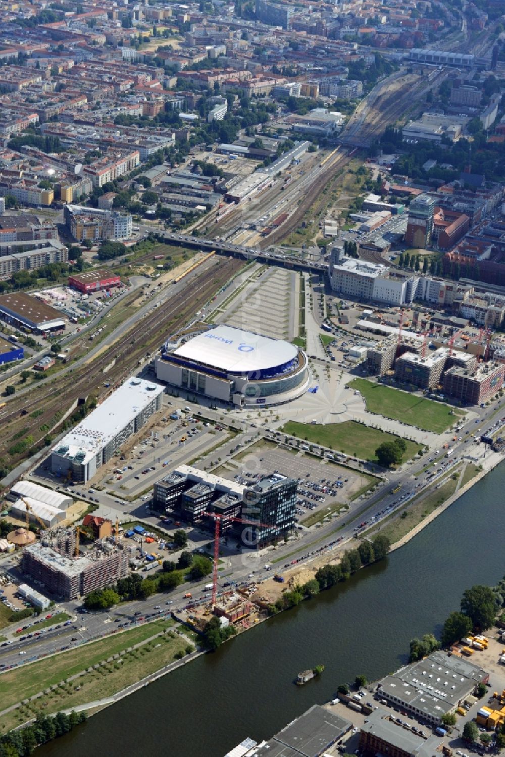 Aerial image Berlin - View at the Media Spree area at the Spree near Ostbahnhof between Oberbaum Bridge and Schilling Bridge in the district of Kreuzberg-Friedrichshain in Berlin. Media Spree is one of the biggest investors projects in Berlin. It aims the establishment of communications and media companies along an area approximately 3.7 km long and is appropriate to restructure. The picture shows among others the O2 Arena, the East Side Gallery, the former Post Station and the Oberbaum Bridge