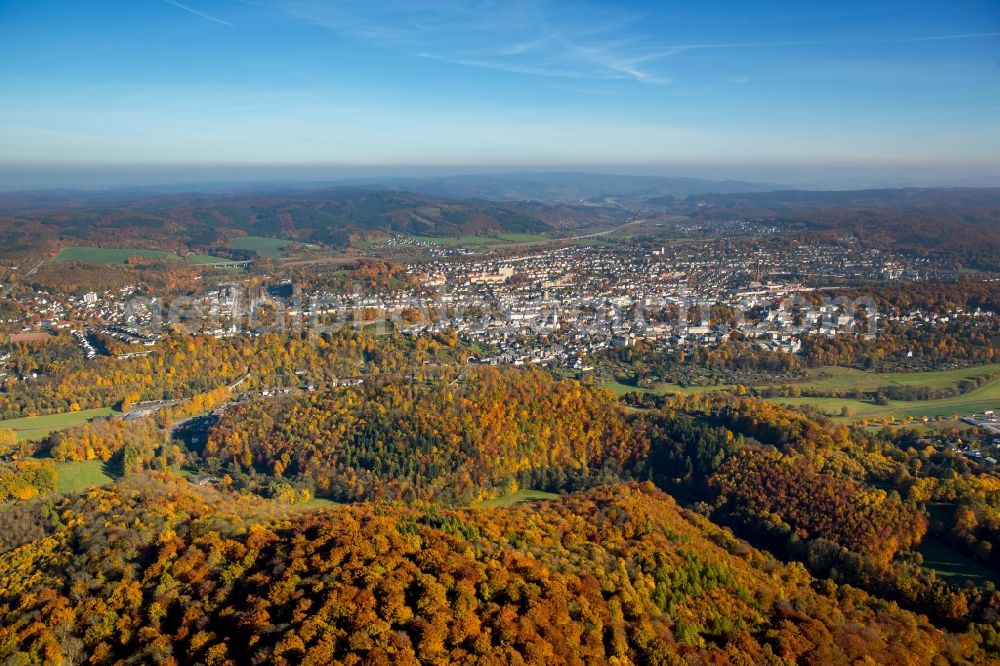 Arnsberg from the bird's eye view: Sea colorful colored leaves on the treetops in an autumnal deciduous tree - woodland in Arnsberg in the state North Rhine-Westphalia