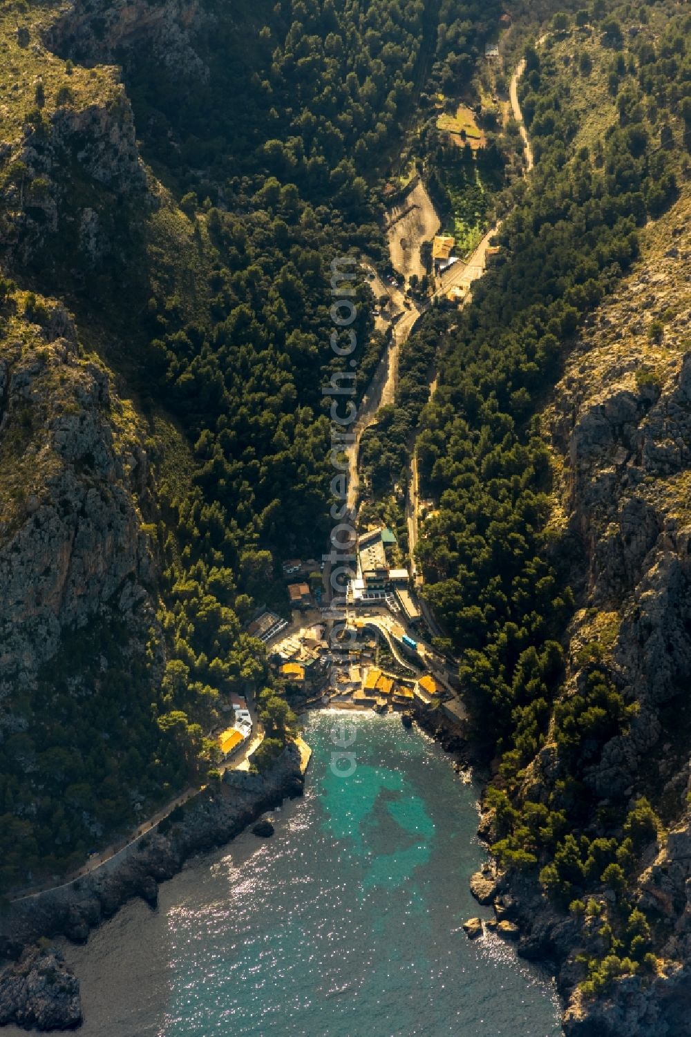 Aerial image Port de Sa Calobra - Townscape on the seacoast of Balearic Sea in Port de Sa Calobra in Balearic island of Mallorca, Spain