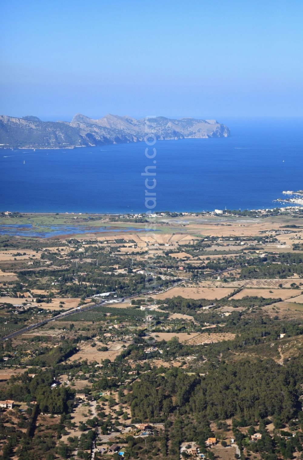 Alcúdia from the bird's eye view: Seacoast of Bay of Pollenca with Tramuntana Mountain Chain in Mallorca in Balearic Islands, Spain