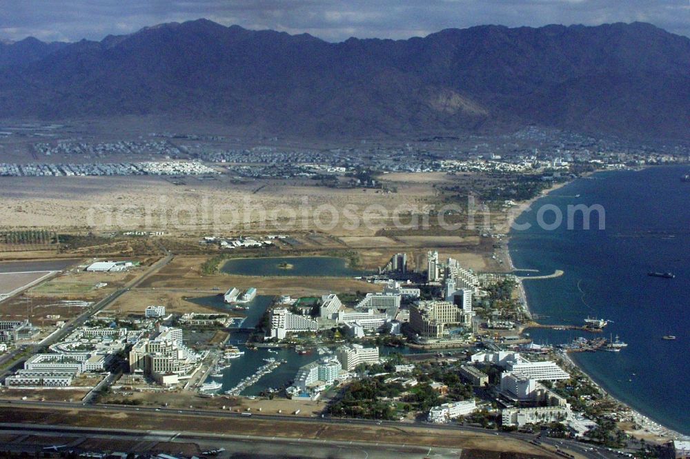 Eilat from the bird's eye view: Townscape on the seacoast of on Gulf of Aqaba in Eilat in South District, Israel. In the Background the city of Aqaba in Jordan