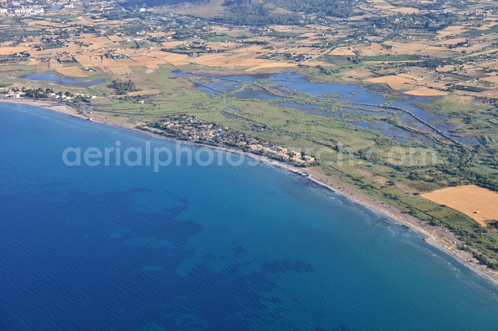 Aerial photograph Muro - Townscape on the seacoast of Mediterranean Sea in Muro in Balearic Islands, Spain