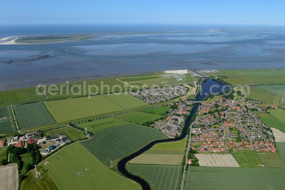 Dornum from the bird's eye view: Townscape on the seacoast of North Sea in Dornum in the state Lower Saxony