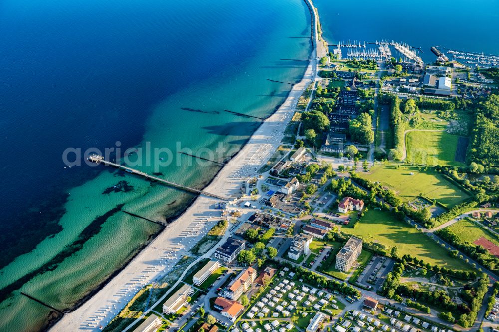 Aerial photograph Großenbrode - Town view on the sea coast of the Baltic Sea in Grossenbrode in the state Schleswig-Holstein, Germany. Campsite at the spa center with a pier on the Baltic Sea beach