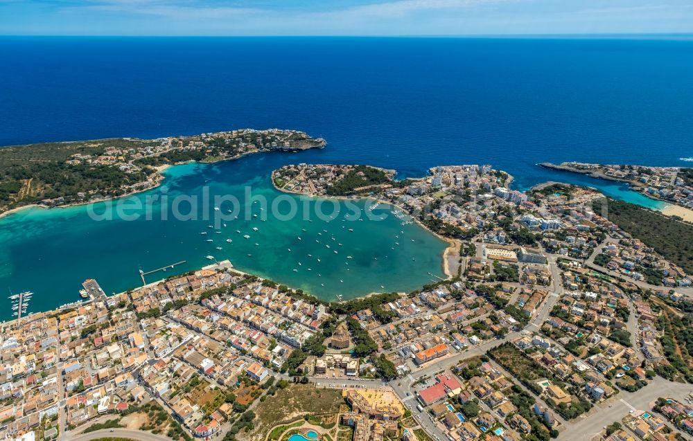 Portocolom from the bird's eye view: Townscape on the seacoast with a marina in Portocolom in Balearic island of Mallorca, Spain