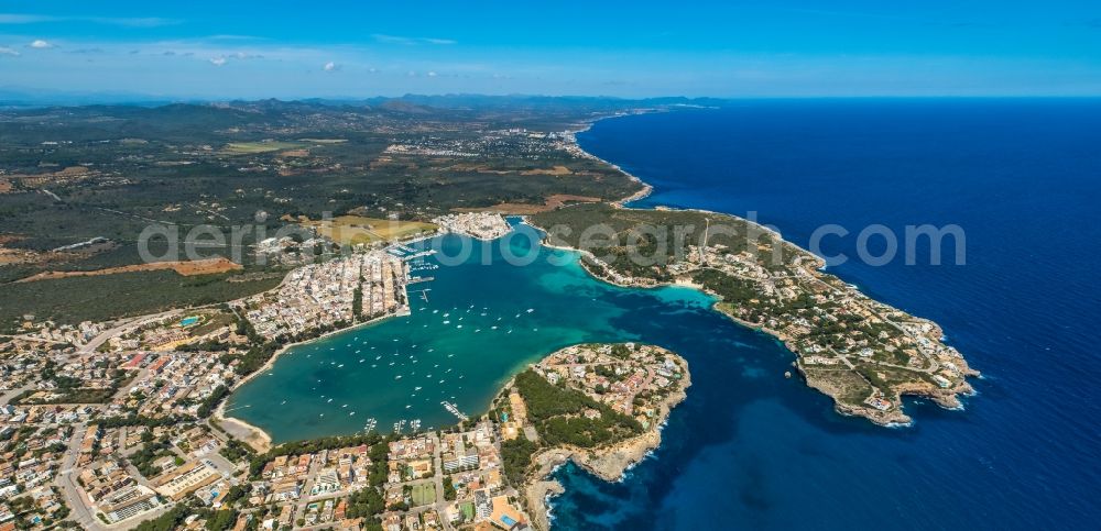 Aerial image Portocolom - Townscape on the seacoast with a marina in Portocolom in Balearic island of Mallorca, Spain