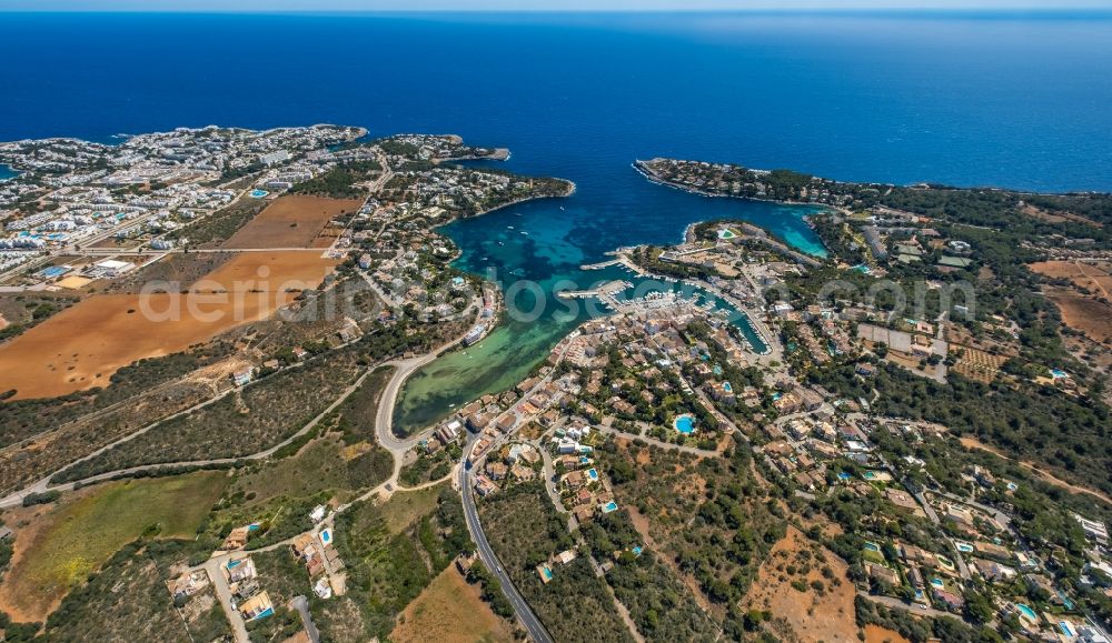 Portopetro from the bird's eye view: Townscape on the seacoast of the bay CalA? des Llamp with a marina in Portopetro in Balearic island of Mallorca, Spain