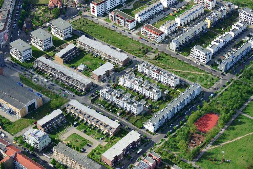 Berlin from the bird's eye view: Urban development area on the premises of Eldenaer road - Storkower Strasse in Friedrichshain district of Berlin. On the grounds of the former East German slaughterhouse incur modern residential areas and neighborhoods. The housing companies in the real estate developers cds Wohnbau Berlin GmbH built on several building plots modern apartments and townhouses and terraced houses