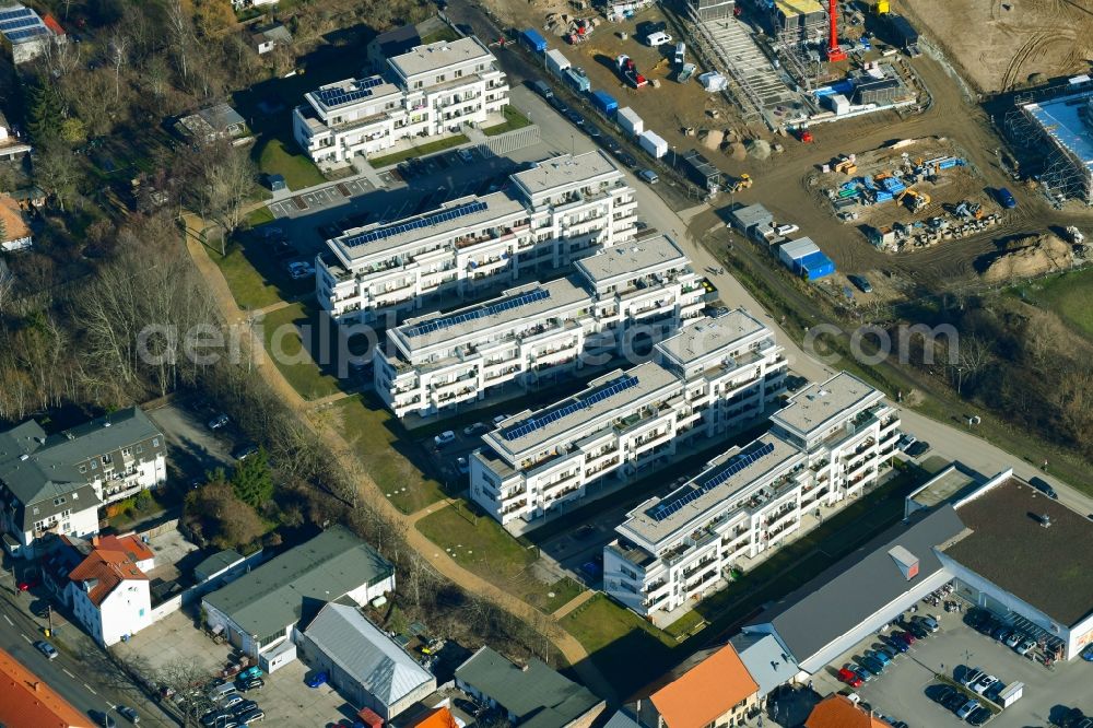 Berlin from the bird's eye view: Construction site to build a new multi-family residential complex An der Schule destrict Mahlsdorf in Berlin