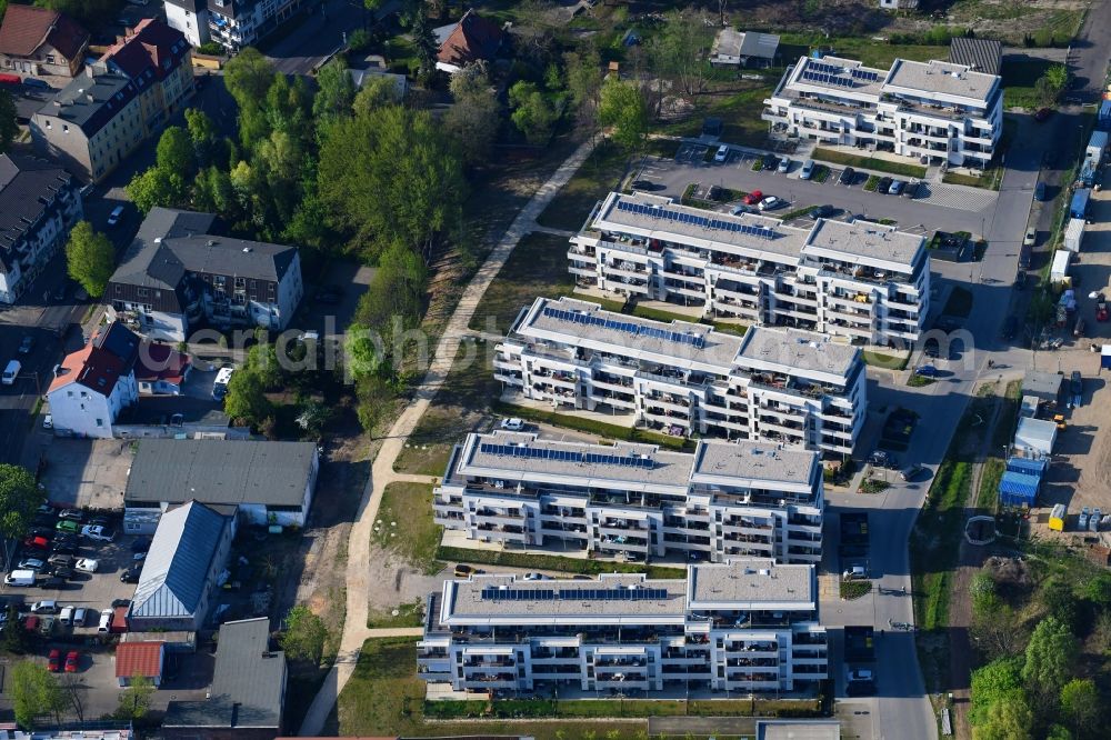 Berlin from the bird's eye view: Construction site to build a new multi-family residential complex An der Schule destrict Mahlsdorf in Berlin