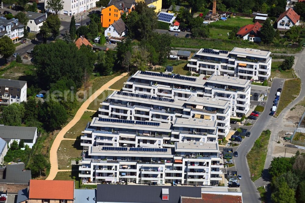 Berlin from the bird's eye view: Construction site to build a new multi-family residential complex An der Schule destrict Mahlsdorf in Berlin