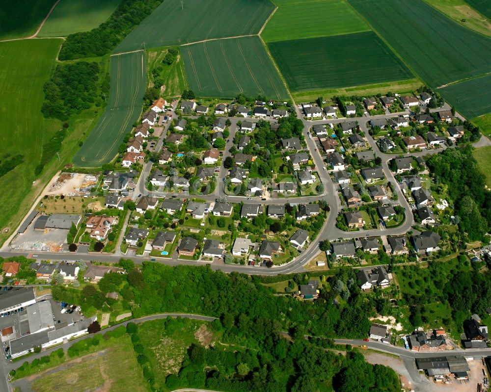 Dauborn from the bird's eye view: Residential area of a multi-family house settlement in Dauborn in the state Hesse, Germany