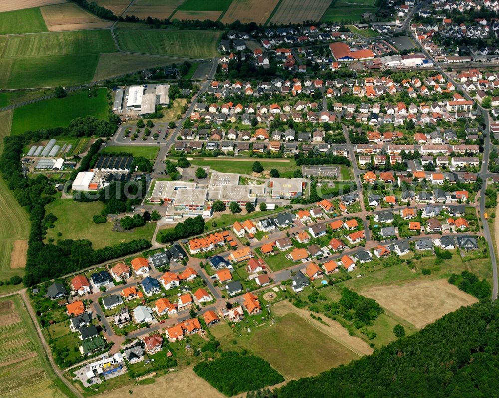 Aerial image Großen-Buseck - Residential area of a multi-family house settlement in Großen-Buseck in the state Hesse, Germany