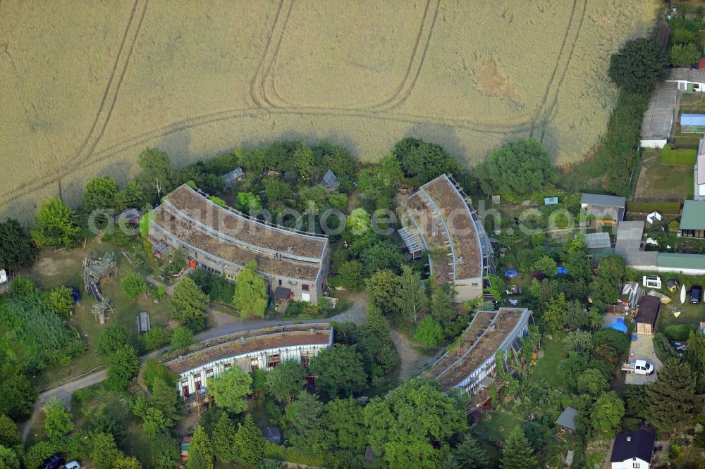 Aerial image Schöneiche bei Berlin - Multi-family house settlement in Schoeneiche bei Berlin in the state of Brandenburg. The architectural distinct complex of four round buildings is located on Landhof street in the Northeast of Schoeneiche one a field