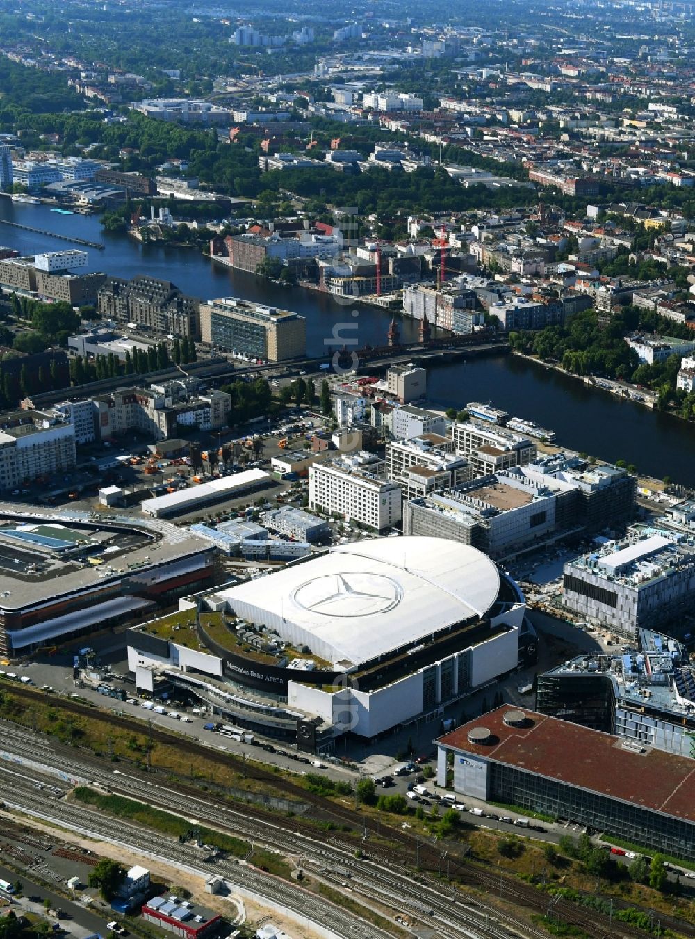 Aerial image Berlin - Arena Mercedes-Benz-Arena on Friedrichshain part of Berlin. The former O2 World - now Mercedes-Benz-Arena - is located in the Anschutz Areal, a business and office space on the riverbank