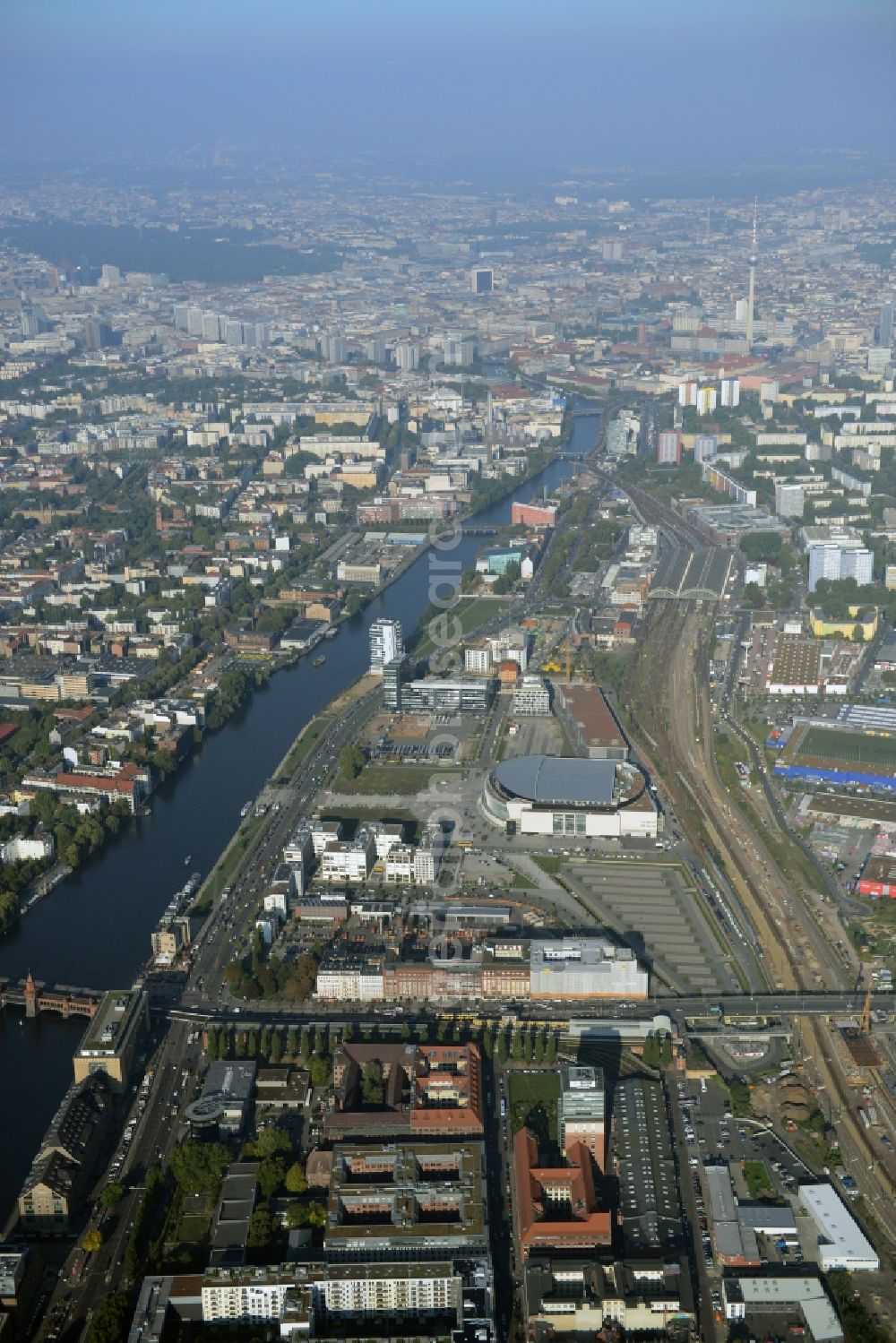 Berlin from above - Mercedes-Benz-Arena on the Spree riverbank in the Friedrichshain part of Berlin. The former O2 World - now Mercedes-Benz-Arena - is located in the Anschutz Areal, a business and office space on the riverbank