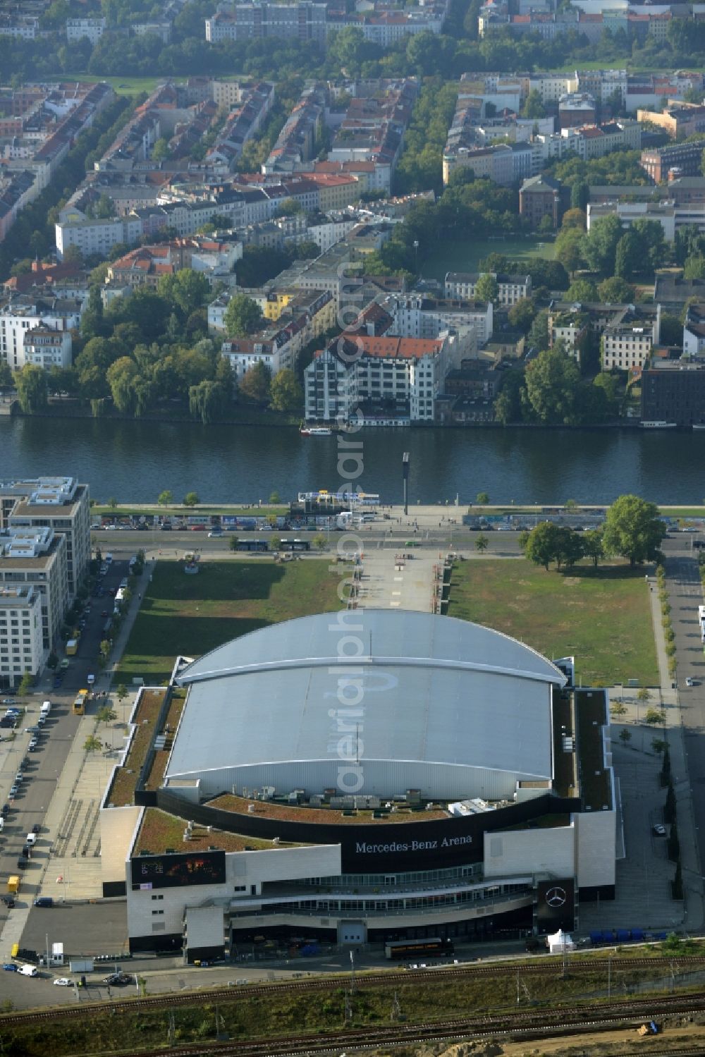 Berlin from above - Mercedes-Benz-Arena on the Spree riverbank in the Friedrichshain part of Berlin. The former O2 World - now Mercedes-Benz-Arena - is located in the Anschutz Areal, a business and office space on the riverbank